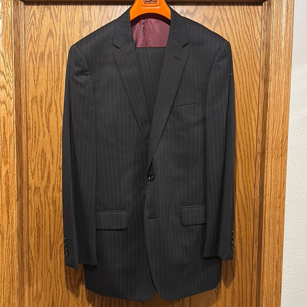 Steven Land suit. Brand new, never worn. Black with gray pinstripes.
